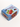 a small light blue box, with images of juicy red strawberies with leaves on it. the text on the box says, juhu beach stufio farms, its light blue and dark blue, with a small indian flag, and the words thicc and juicyy, export quality