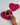 Two rani pink heart-shaped macramé coasters arranged together