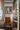 'Mistress of Moons' hand-painted canvas art shown in a styled room setting — Loka Loka Studio